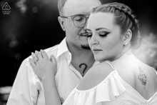 Black and white close-up engagement portrait of a couple embracing in Bucharest, Romania, highlighting their emotional connection.