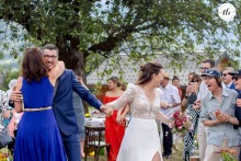 Following the ceremony in Jarsy, France, pure joy radiates among the wedding couple and guests, highlighting a sense of celebration and happiness for the newlywed couple.