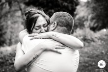 Tucked outdoors at Domaine de l’Ecoutoux in Quaix-en-Chartreuse, France, the bride tightly hugs her brother, eyes closed in emotion, savoring a touching sibling moment.