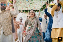 Bride's Joyful Journey at Grand Hyatt In Goa, India's Festive Wedding Party A vibrant and joyful wedding moment captured at Grand Hyatt in Goa, India, as the bride walks down the aisle surrounded by festive colors and celebration, epitomizing the joy and fun of the party atmosphere at this memorable event.