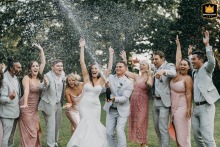 Celebrating love at The Ivy Place in Lancaster, SC, as the newlyweds pop the champagne with loved ones before the electrifying dance party begins.