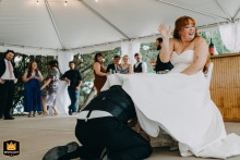At The Villa Franca in China Grove, NC, the groom retrieves the garter from the bride's leg during the lively garter toss tradition.
