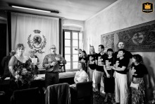 At Broletto Palace, Brescia, guests entertain with a theatrical improvisation during the ceremony, adding a unique and playful touch.
