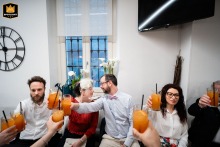 In a Ghedi bar, the newlyweds toast joyfully with a few guests, celebrating together after the civil ceremony.