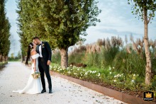 At Tenuta Acquaviva, Travagliato, the newlyweds share a tender kiss during their portrait session, capturing their deep connection.