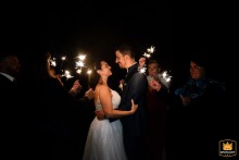 At Domaine de Blacons in Crest, France, the couple and their wedding party enjoy a playful portrait with sparklers.