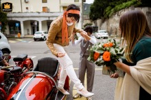 At Sala delle Colonne in Botticino, the graceful bride is assisted as she gets off the sidecar she arrived in.