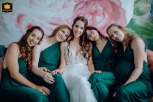 Budapest Hotel wedding: Bride surrounded by loved ones, radiating joy and unwavering support in this group portrait