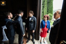 Witnesses adjust groom's collar as the parents watch at Monticelli Brusati, Parrocchia dei Santi Tirso e Emiliano.