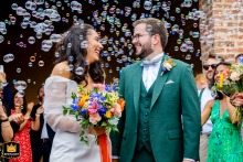 At the exit of Léojac town hall, the newlyweds are photographed under a cloud of soap bubbles, captured by a WPJA photographer.