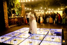Bride and groom share a beautiful first dance at Enjoy Eventos in Porto Alegre, captivating guests with their elegance and love.