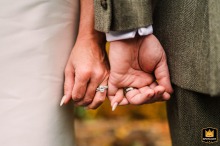 A detail shot from Snoqualmie Pass, WA: the bride and groom link pinkies, showcasing their new wedding rings.