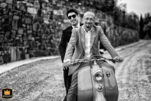 The groom rides on the back of a Vespa driven by his uncle. This fun, classic moment at Colletto AgriBioRelais in Italy captures the joyful spirit of the wedding day.