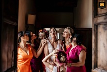 Bride and bridesmaids in dresses at Palazzo Viviani, Monte Gridolfo, Rimini, Italy, before the wedding.