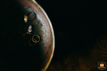 Close-up of a bride's jewelry in an antique bowl at a Hotel in Poland.