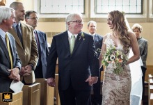 Bride and her father share a moment walking down the aisle at Emory Presbyterian Church in Atlanta, Georgia.