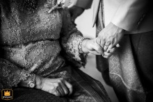A Touching Moment: A Family's Hands Hold Tightly in Bangkok Bangkok, Thailand: A touching detail shot of a family's hands holding tightly during a wedding.