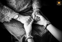 Older Hands Gently Clasp Younger Hands in Emotional Detail Shot at St. Regis Bangkok St. Regis Bangkok, Thailand, is where a moment of emotional touch is captured as an older person's hands gently clasp a younger person's hands in a heartfelt detail shot.