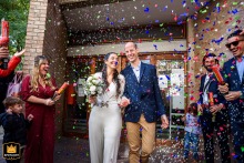Colorful confetti flying over the newlywed couple as they exit in Distrito Centro, Rosario, Santa Fe.