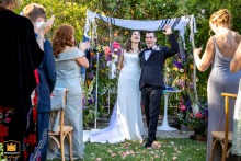 At Lavender Inn in Ojai, California, the wedding culminates with the traditional Jewish ritual as the groom stomps on a glass, marking the close of the ceremony.