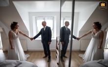At her parents' home in Ille-et-Vilaine, Brittany, a father experiences a heartfelt first look as he discovers his daughter in her wedding dress for the very first time.