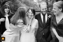 The happy bride and groom receive warm congratulations from their loved ones at the historic Robert Treat Paine Estate, known as Stonehurst, in the city of Waltham, Massachusetts.