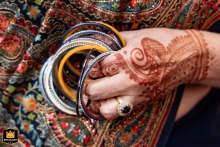 Relative Holds Bridal Bangles At Monday Night Brewery In Atlanta, Georgia At Monday Night Brewery in Atlanta, Georgia, a relative of the bride carefully holds her bangles, preserving a meaningful detail of the wedding day and its family traditions.