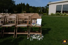 At The Lakehouse in Halifax, Massachusetts, a reserved memorial seat honors the bride’s father, a touching tribute acknowledging his presence in spirit on the wedding day.