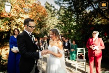 Bride And Groom Exchange Rings At La Casina Residenza Di Campagna In Italy The visibly excited bride and groom exchange wedding rings at La Casina Residenza di Campagna in Pievedizio (BS), Italy, during an emotional and joyful ceremony.
