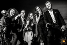Laughter, movement, and genuine emotion fill the dance floor in Bucharest, Romania, creating a vibrant scene of connection, energy, and wedding celebration.