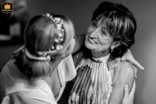A tender embrace between mother and daughter in Bucharest, Romania, reveals the deep emotions and meaningful family connections that define a wedding day.