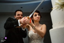 Antalya, Turkey, Akra Barut Hotel wedding image contains: The cake cutting with a huge sword