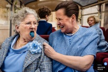 Brugge wedding reportage photojournalist created this image of an older woman with a bright blue tongue