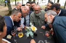 Guests at Domaine de Taysse's outdoor reception party enjoyed a cocktail hour of watching rugby on their phones under the trees Set against an idyllic backdrop of Domaine de Taysse, male guests at an outdoor reception party enjoyed the cocktail hour watching rugby on their phones while standing beneath the trees at a table