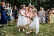 Saint-Ybard: Daughters Duel over Flowers in Award-Winning Wedding Moment Wedding photographer captures an award-winning moment as the bride and groom's daughters vie for the bouquet on the lawn of Saint-Ybard.