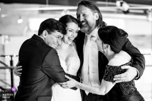 Moments before the ceremony at Zen, Greenville, the bride and her brother share a joyful, heartfelt group hug with their parents.