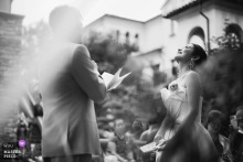 Hyatt Regency Chongming, Shanghai, China		The groom reads from a piece of paper while the bride looks up, moved with smile.