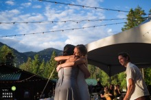 Teary-eyed Bride Shares A Heartfelt Hug With Her Bridesmaid At Beyond Hope Resort In Idaho A teary-eyed bride shares a long, heartfelt hug with her bridesmaid following an emotional speech during a beautiful waterfront wedding reception at the Beyond Hope Resort in Idaho.