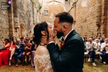 Couple Embrace At End Of Secular Ceremony At Abbaye Du Pin Béruges Highlighting Emotional Connection At Abbaye du Pin in Béruges, the photographer captures the couple’s embrace at the end of their secular ceremony, expertly highlighting love and emotional connection.