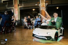 Bride and Groom Distribute Champagne from Toy Car at Turner Hall Ballroom Wedding Bride and groom in a souped-up toy car, handing out champagne at Turner Hall Ballroom, Milwaukee, Wisconsin.