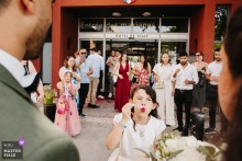 Joyful Bubble Exit at Saint-Priest City Hall with Bride, Groom, and Bridesmaid Bubble-filled wedding exit at the city hall of Saint-Priest, France with the happy couple and their bridesmaid.