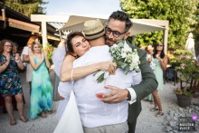The bride and groom at Le Clos de Florie in Savoie, France, warmly thank a guest for their speech.