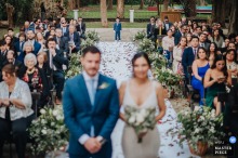 Haras Santa Lucia Chapel, Buenos Aires Wedding: Son Waits To Bring Rings Forward At the chapel in Haras Santa Lucia, Buenos Aires, the couple’s son waits for his cue to bring the rings forward, with the bride and groom softly blurred in the foreground.