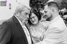 Puy de Dôme Town Hall Wedding: Groom’s Parents Share Hug Before Ceremony At the town hall in Puy de Dôme, the groom’s mother and father share a heartfelt hug before entering for the wedding ceremony.