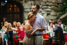 At Arrow Park, NY, an emotional mother-son dance unfolds as the groom shares a heartfelt moment with his mother, capturing love, gratitude, and the bond between them during the wedding celebration.