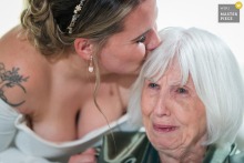 Bride Expresses Love To Grandmother At Glenora Winery Dundee New York Ceremony At Glenora Winery in Dundee, New York, a bride steps away during the ceremony to express her love to her grandmother, who bursts into tears.