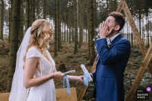   At Gut Ahe in Sauerland, NRW, Germany, the groom struggles to hold back tears while the bride reads her vows, the moment filled with sincerity and love.