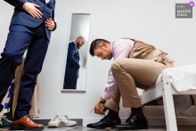   Château de Beauséjour in Dordogne, France sets the scene as a wedding witness quietly observes his best friend’s final she tying moments of preparation before the ceremony.