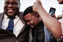   At Urla Sahne in Urla, Izmir, Turkey, the groom’s brother is visibly moved, experiencing deep emotions during the heartfelt wedding ceremony in this scenic Turkish venue.