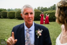 At Château de Mauriac, a bridesmaid bursts into laughter in the background, bringing a sense of joy and spontaneity to the celebration.
